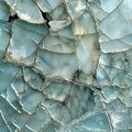 Intricate patterns of cracked blue glass shimmering under soft, natural light Royalty Free Stock Photo