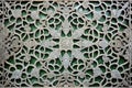 intricate patterns on green marble stone