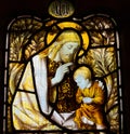 Jesus Christ blessing a young child. Stained glass window. Royalty Free Stock Photo