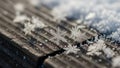 Snowflakes appear crisp and detailed with a backdrop of more snow Royalty Free Stock Photo