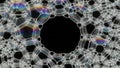 Intricate Soap Bubble Foam Structure with Iridescent Hues on Black Background Royalty Free Stock Photo