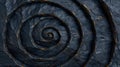 Intricate spiral pattern in dark stone