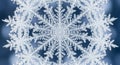 Intricate, symmetrical snowflake design against a blurred blue background. The Royalty Free Stock Photo