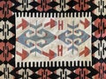 Intricate tribal-patterned Turkish rug with geometric shapes and traditional handwoven design, featuring a rich blend of colors Royalty Free Stock Photo