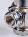 Close-up of a metallic mechanical component showcasing threaded connection and precise machining details, emphasizing industrial Royalty Free Stock Photo