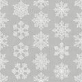 Intricate white snowflake patterns on a textured gray background. Each snowflake is Royalty Free Stock Photo