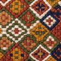 Intricate woven textile featuring a pattern of interlocking geometric shapes. The Royalty Free Stock Photo