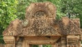 Intricately carved stone pediment at banteay srei temple