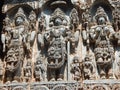 Intricately carved stone statues of Hindu gods adorning the Hoysaleshwara Temple in Halebedu, India Royalty Free Stock Photo