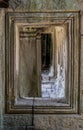 Carved stone window with pillar and corridor in Temple Siam Reap Cambodia