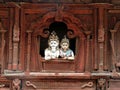 Intricately carved temple detail with Hindu man and woman,Patan, Nepal