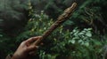 A intricately carved wand made from a rare wood found only in the most enchanted forests. When held it radiates an aura