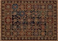 Intricately designed rug with a dark background, features an elaborate geometric pattern of Royalty Free Stock Photo