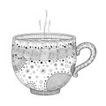 Intricately designed steaming tea cup with decorative patterns Royalty Free Stock Photo