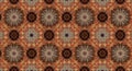 Intricately patterned kaleidoscopic design featuring floral motifs in warm tones of