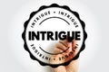 INTRIGUE badge graphic with bold centered lettering and a hand holding a marker, producing a curiosity-driven visual suited for Royalty Free Stock Photo