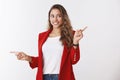 Intrigued enthusiastic good-looking female shopoholic seeing awesome promo smiling excited looking aside pointing Royalty Free Stock Photo