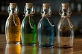 intriguing arrangement of colored bottles filled with various liquids, set against backdrop of table Royalty Free Stock Photo