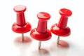 Intriguing CloseUp of Three Red Safety Pins on a Pristine White Background A Versatile Stock Image for Design Royalty Free Stock Photo