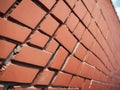 Intriguing Diagonal Pattern on a Vibrant Red Brick Wall A Study in Geometric Design and Architectural Detail Royalty Free Stock Photo