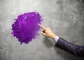 Intriguing Purple Paint Blob Person Points to Abstract Art