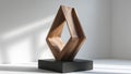 Intriguing wooden sculpture forming an abstract shape on a plinth Royalty Free Stock Photo