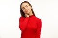 Intriguing young woman, looks mysteriously aside, has brilliant idea in mind. Fomale poses against white studio background