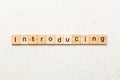 introducing word written on wood block. introducing text on table, concept Royalty Free Stock Photo
