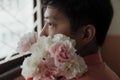 Introspective Asian Gay and His Flowers Royalty Free Stock Photo