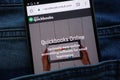 Intuit Quickbooks website displayed on smartphone hidden in jeans pocket
