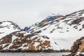 Inuit houses hidden among the rocks at the rocky fjord  in the middle of nowhere, Kangamiut Royalty Free Stock Photo