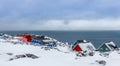 Inuit village houses covered in snow at the fjord of Nuuk city, Greenland