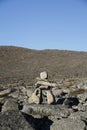 Inukshuk or Inuksuk along a hiking trail near the community of Qikiqtarjuaq, Broughton Island