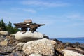 Inukshuk on rocky Nova Scotia, Canada coastline Royalty Free Stock Photo