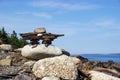 Inukshuk on rocky Nova Scotia, Canada coastline