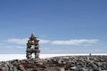 Inuksuk landmark with frozen bay in the background Royalty Free Stock Photo