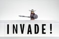 Invade! Invasion concept. Illustrative editorial