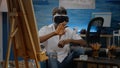 Invalid african american person using vr goggles for fine art