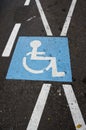 Invalid parking place sign on asphalt Royalty Free Stock Photo