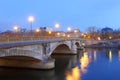 Invalides bridge In the night illumination . Night view of Seine river and bridge in Paris Royalty Free Stock Photo