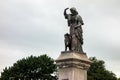 Statue of Flora MacDonald with a border collie dog in front of the Inverness Castle