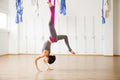 Inversion locust pose in aero anti gravity yoga. Aerial exercises