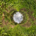 Inversion of tiny planet transformation of spherical panorama 360 degrees. Spherical abstract aerial view in Apple orchard.