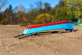 Inverted boat on the sandy shore of the lake Royalty Free Stock Photo