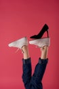 inverted foot black shoe fashion modern style pink background