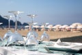 Inverted glasses on the table at the beach cafe