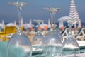 Inverted glasses on the table at the beach cafe