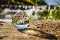 Inverted image in lensball with shadow on a waterfall rock on the river beach of PoÃÂ§o de Corga, Castanheira de PÃÂªra PORTUGAL