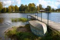 Inverted iron boat and wooden pier Royalty Free Stock Photo