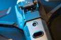An inverted Mavic 2 Pro quadcopter on a black background in blue light. Infrared sensors and sensor system, diode lamp